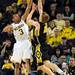Michigan sophomore Trey Burke attempts to block a shot by Iowa freshman Mike Gesell during the first half against Iowa at Crisler Center on Sunday, Jan. 6. Michigan beat Iowa 95-67 in the Big Ten home opener. Melanie Maxwell I AnnArbor.com